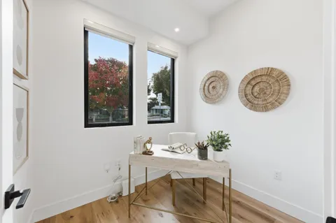 a bedroom with a bed and a desk