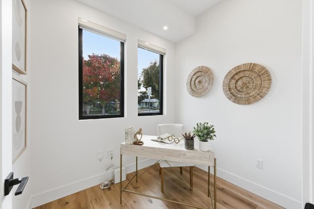 a bedroom with a bed and a desk