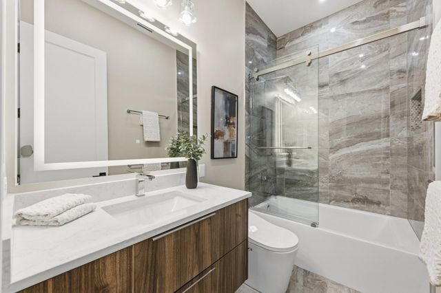 a city street lined with lots of tall buildings