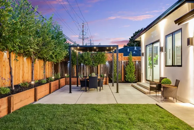 a man walking down a street next to a building