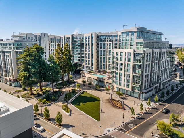a view of a street with a building in the background