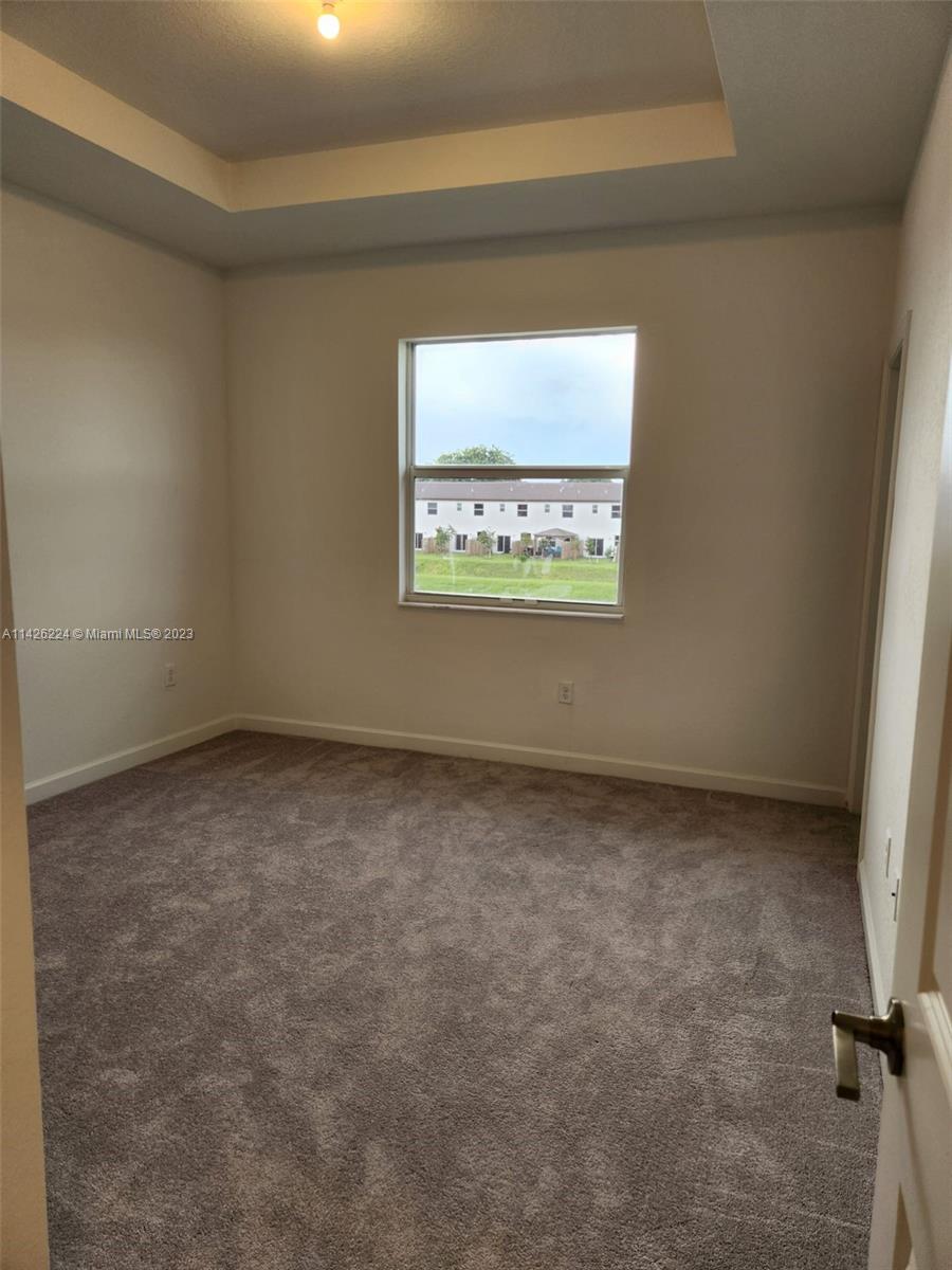Miami-Dade County Miami, FL 33167 - Photo 17 of 18 a view of an empty room and a window