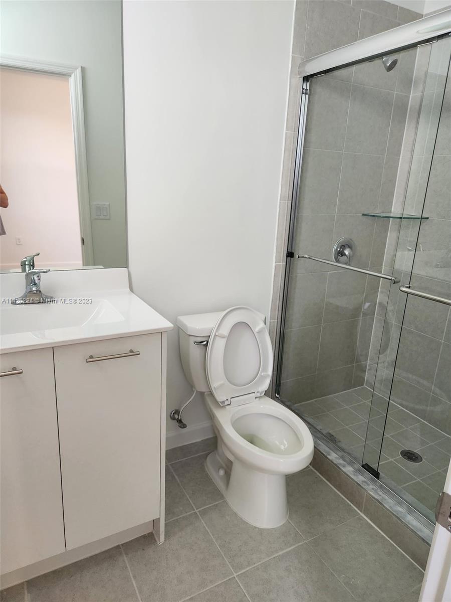 Miami-Dade County Miami, FL 33167 - Photo 18 of 18 a white toilet sitting next to a bathroom sink