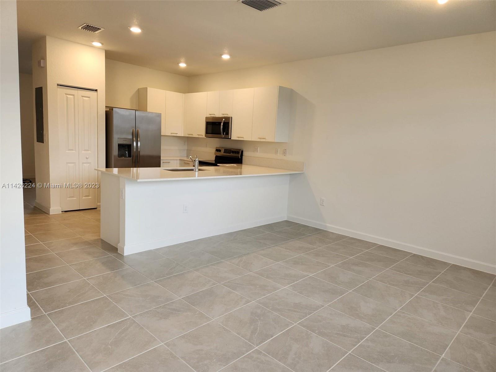Miami-Dade County Miami, FL 33167 - Photo 4 of 18 a view of kitchen with stainless steel appliances a refrigerator and microwave