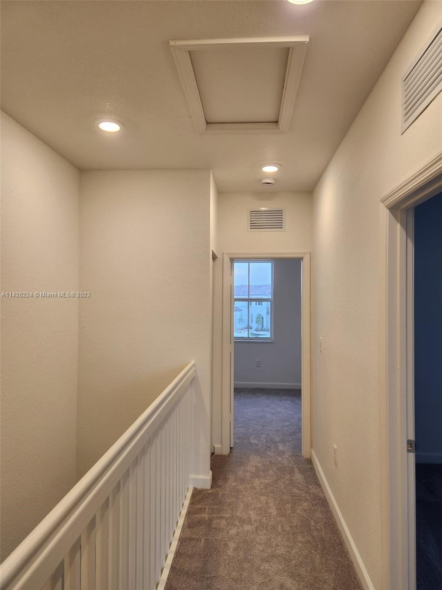 Miami-Dade County Miami, FL 33167 - Photo 5 of 18 a view of hallway with stairs