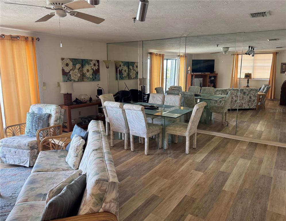16330 Gulf Boulevard, Unit 201 Redington Beach, FL 33708 - Photo 14 of 30 a view of a dining room with furniture window and wooden floor