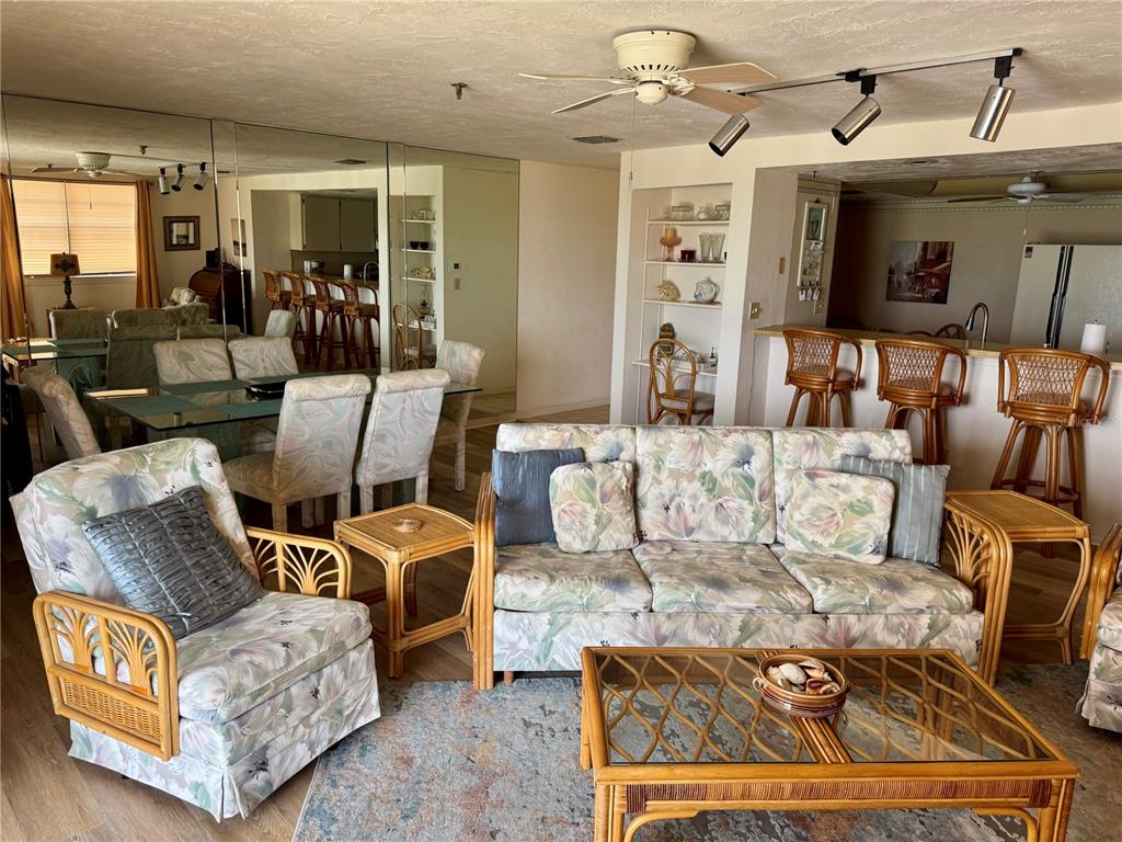 16330 Gulf Boulevard, Unit 201 Redington Beach, FL 33708 - Photo 16 of 30 a living room with furniture and a flat screen tv