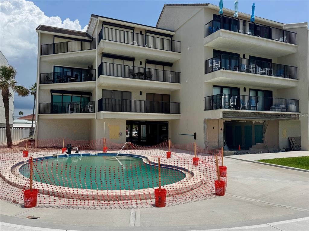 16330 Gulf Boulevard, Unit 201 Redington Beach, FL 33708 - Photo 28 of 30 a house view with a outdoor space