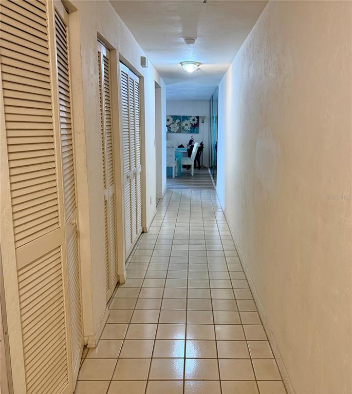 16330 Gulf Boulevard, Unit 201 Redington Beach, FL 33708 - Photo 9 of 30 a view of a livingroom with furniture and an entrance door