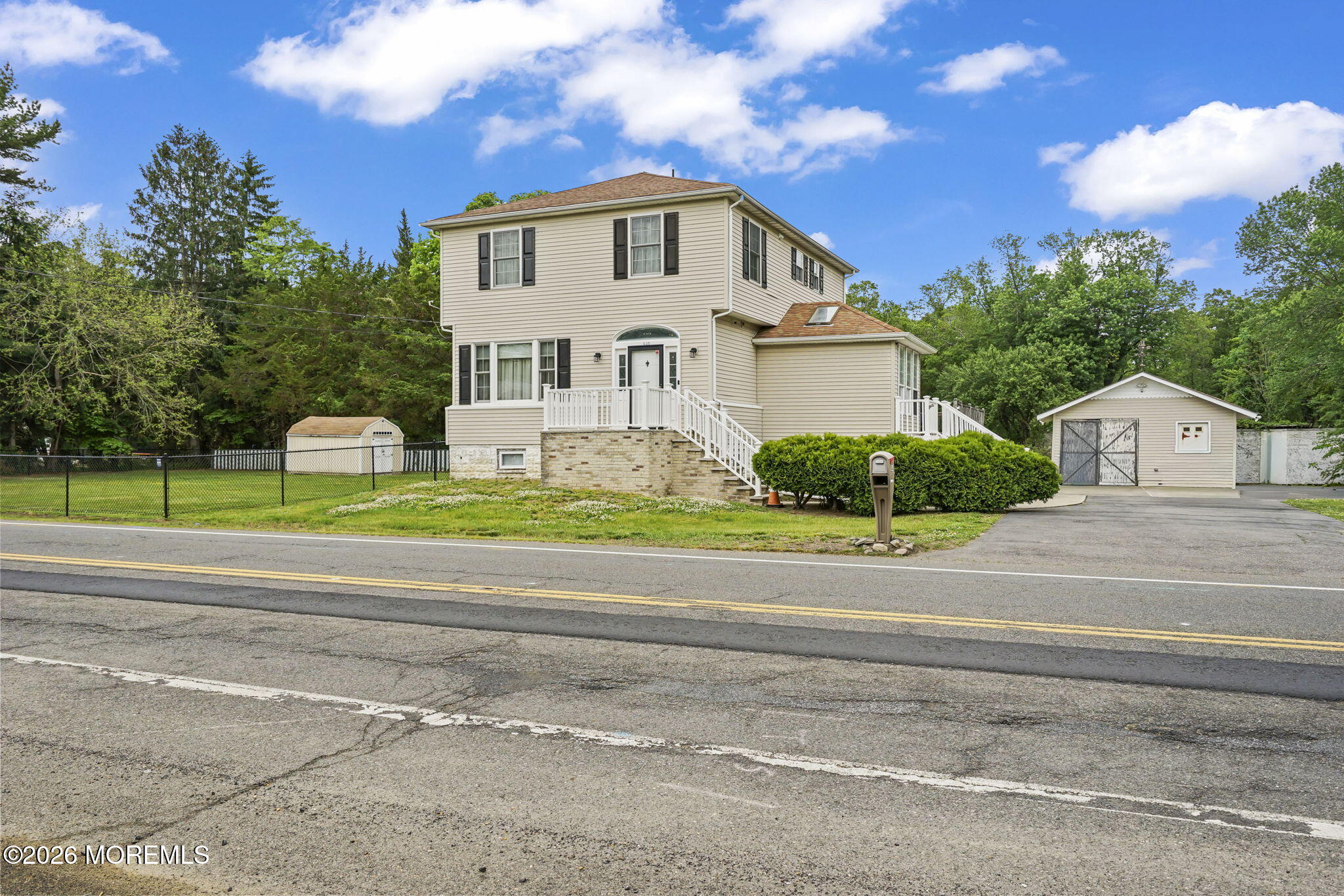 438 Bennetts Mills Road Jackson, NJ 08527 - Photo 26 of 42 a front view of a house with a garden