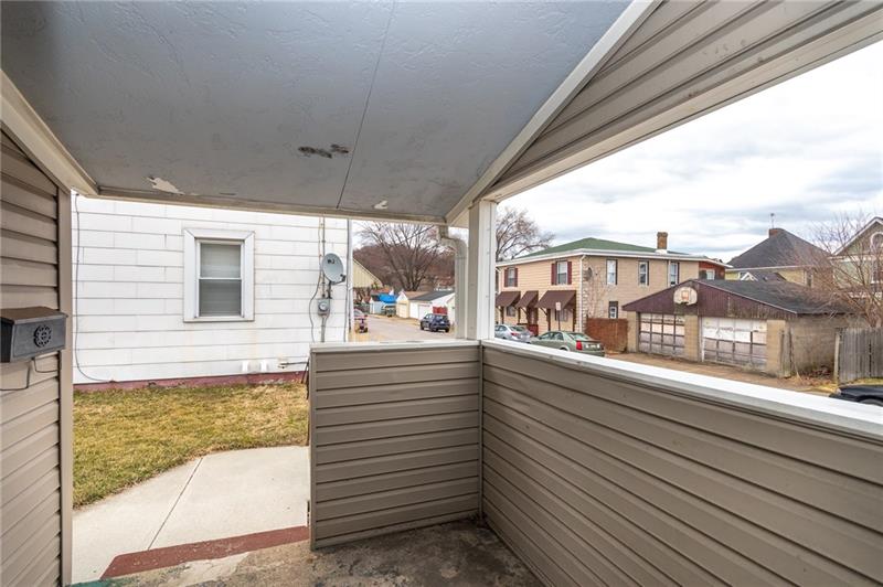 556 East Madison Street Rochester, PA 15074 - Photo 2 of 19 Cozy, covered porch protects you from the weather yet offers great natural lighting. Sit a spell and relax.