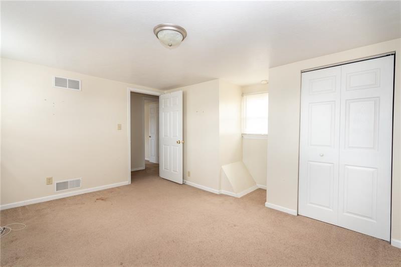 556 East Madison Street Rochester, PA 15074 - Photo 11 of 19 Bedroom 2. Light, bright and spacious. The white trim and doors pop against the warm, subtle, neutral walls. Carpet to be cleaned