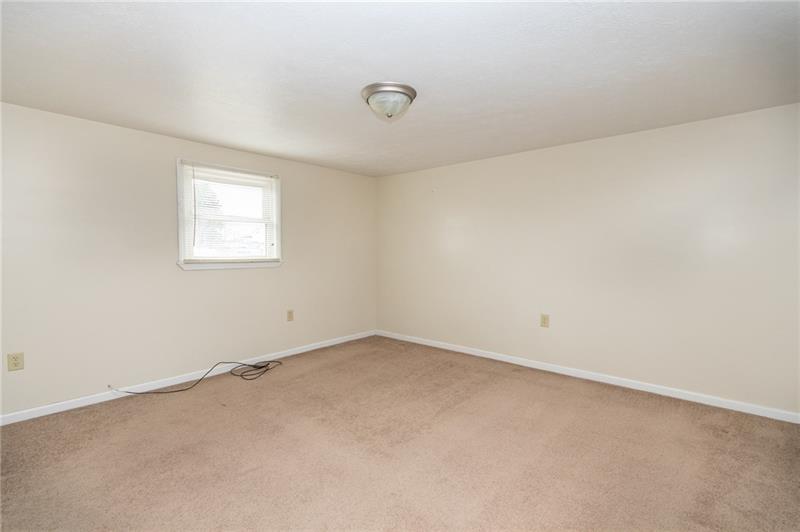 556 East Madison Street Rochester, PA 15074 - Photo 15 of 19 MBR. Warm neutral walls and white trim. Sunlight splashes throughout.
