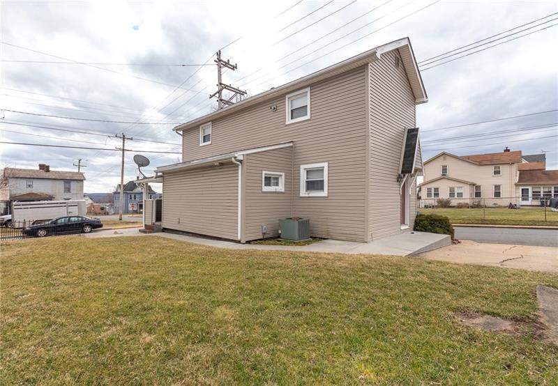 556 East Madison Street Rochester, PA 15074 - Photo 3 of 19 View from right rear corner of yard shows a nice sized yard for outdoor enjoyment, offstreet parking and newer concrete sidewalks!