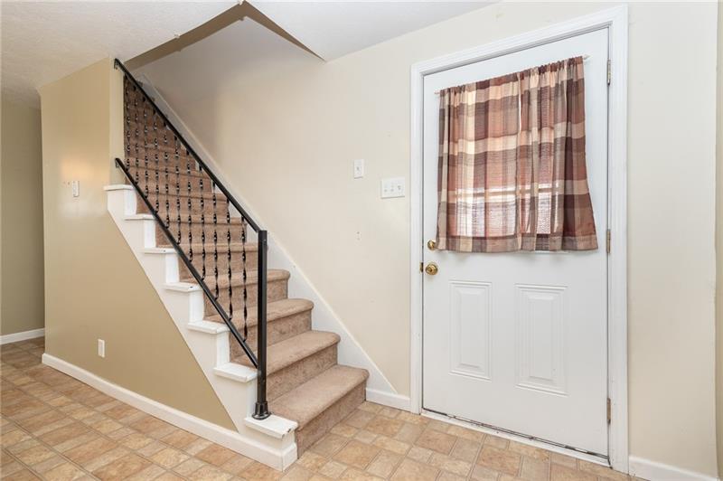 556 East Madison Street Rochester, PA 15074 - Photo 4 of 19 Main entry door from E Madison Street conveniently opens into the kitchen area.
