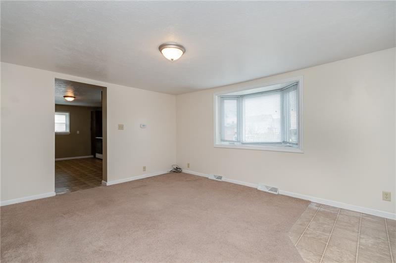 556 East Madison Street Rochester, PA 15074 - Photo 6 of 19 Living Room looking into Kitchen.