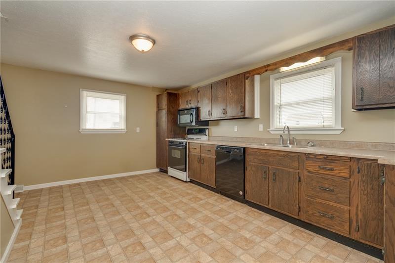 556 East Madison Street Rochester, PA 15074 - Photo 8 of 19 Wow. Can you say counterspace!!! Great work and storage for all your favorite kitchen items! Plenty of natural light! Very new dishwasher. Gas stove & built-in microwave also included.