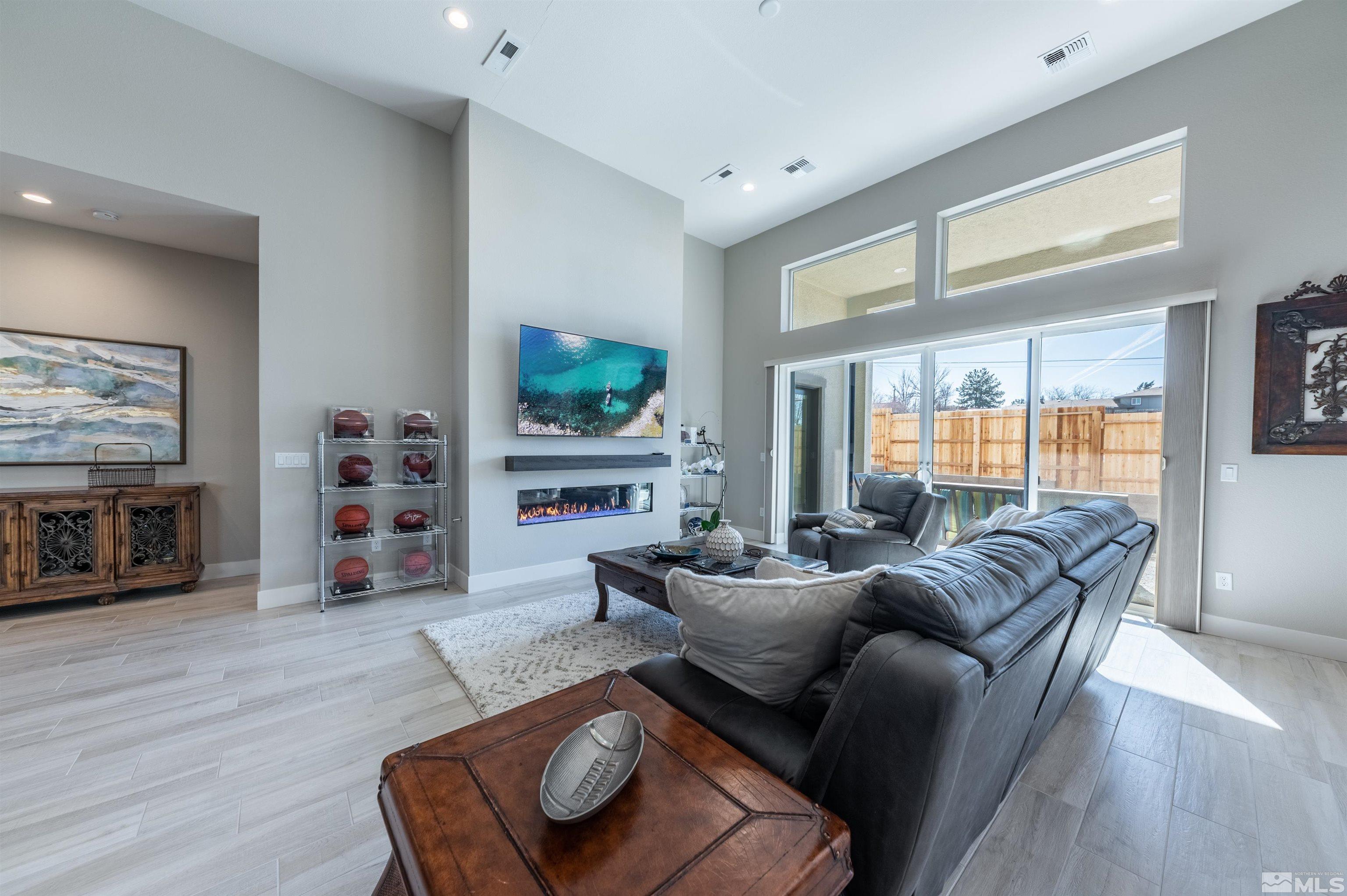 2962 Saddle Peak Drive Reno, NV 89521 - Photo 11 of 39 a living room with furniture and a flat screen tv