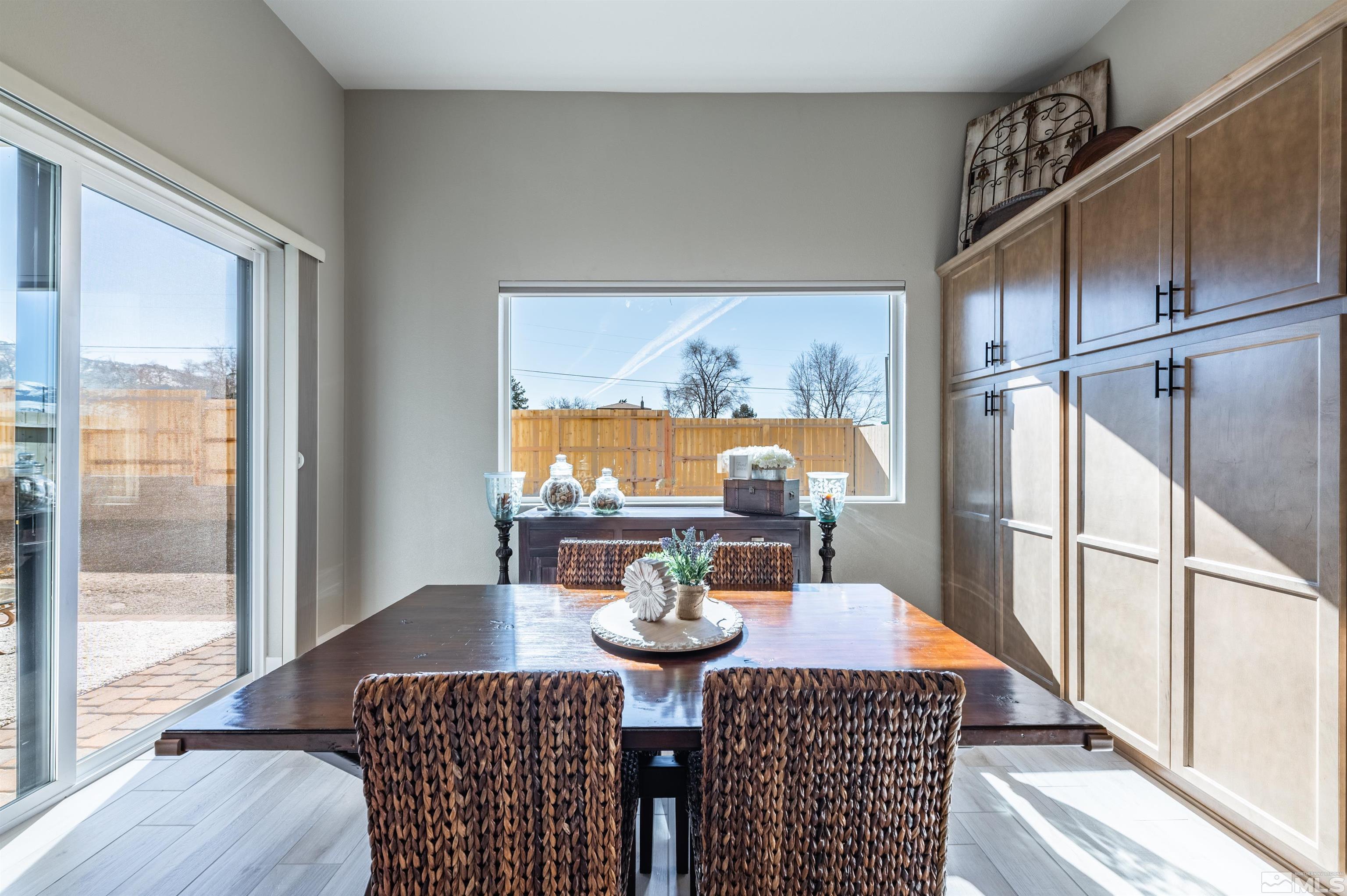 2962 Saddle Peak Drive Reno, NV 89521 - Photo 17 of 39 a view of a dining room with furniture window and wooden floor