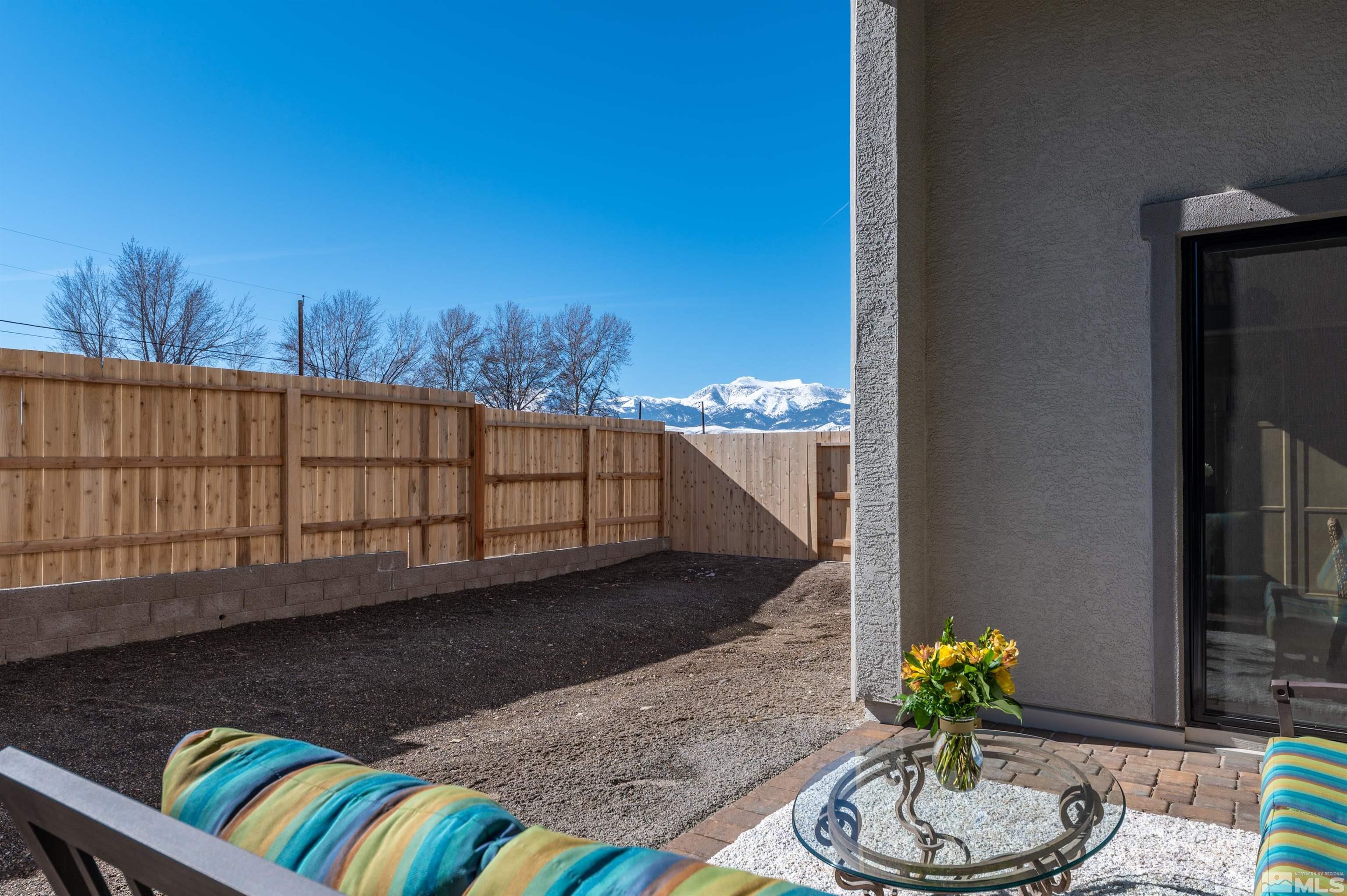 2962 Saddle Peak Drive Reno, NV 89521 - Photo 2 of 39 a view of a balcony with chair and table