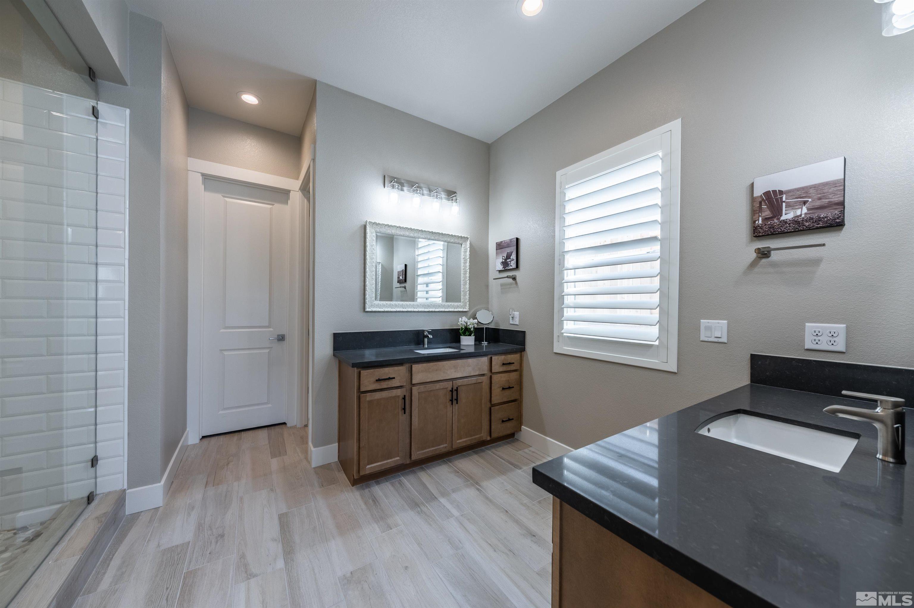 2962 Saddle Peak Drive Reno, NV 89521 - Photo 21 of 39 a open kitchen with sink cabinets and wooden floor