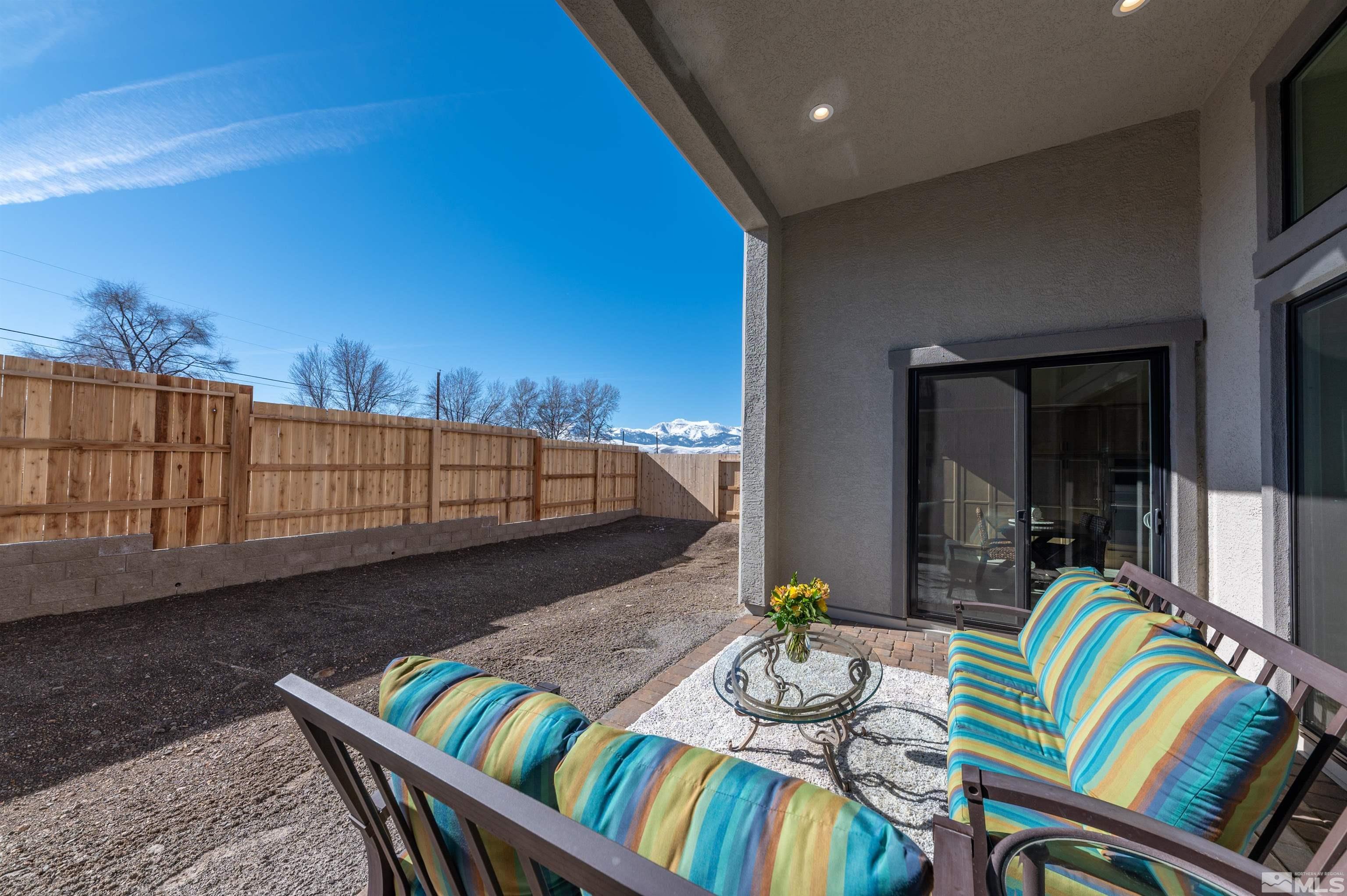 2962 Saddle Peak Drive Reno, NV 89521 - Photo 24 of 39 a balcony with furniture and a potted plant