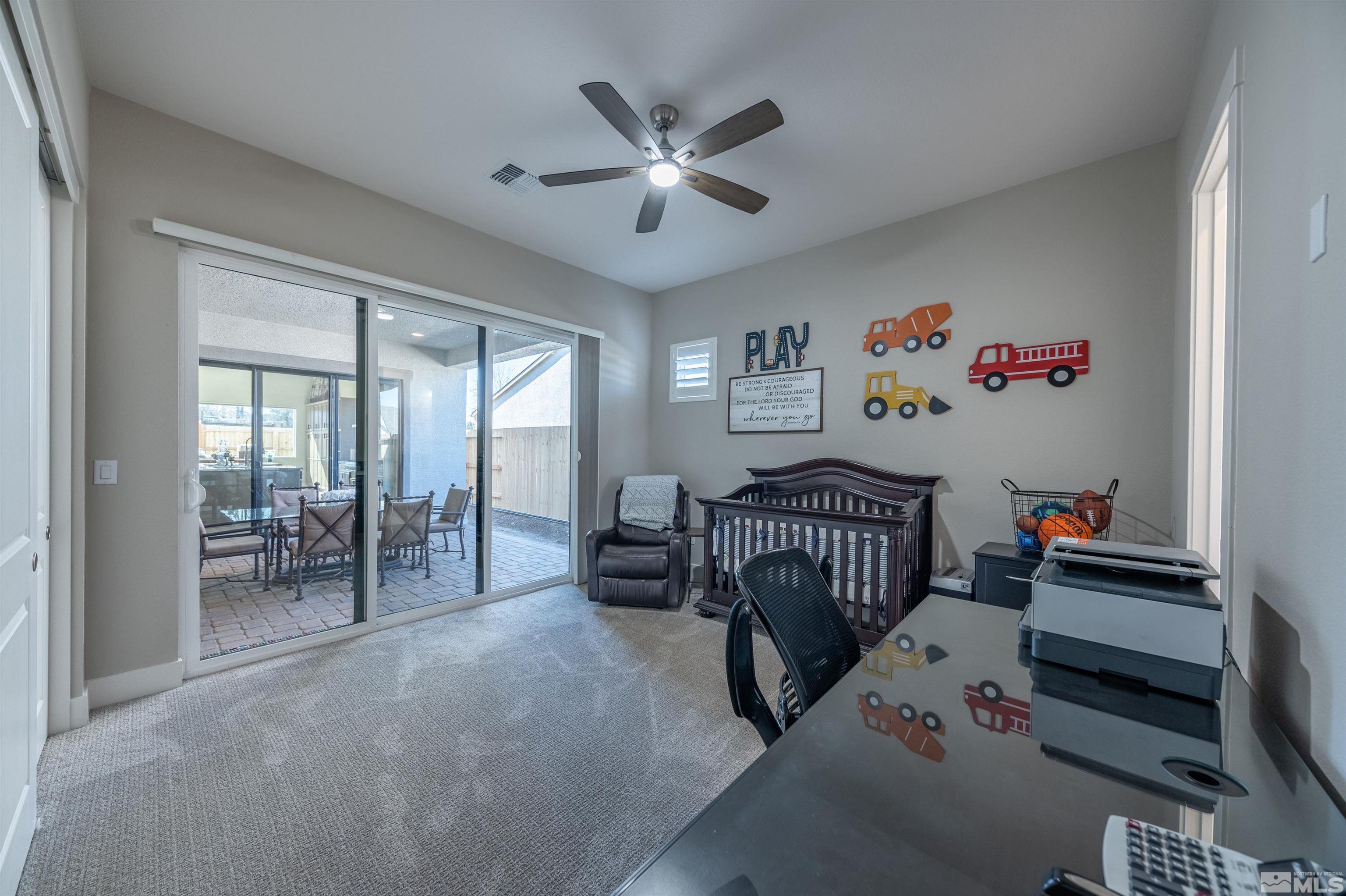 2962 Saddle Peak Drive Reno, NV 89521 - Photo 30 of 39 a bedroom with furniture and a large window