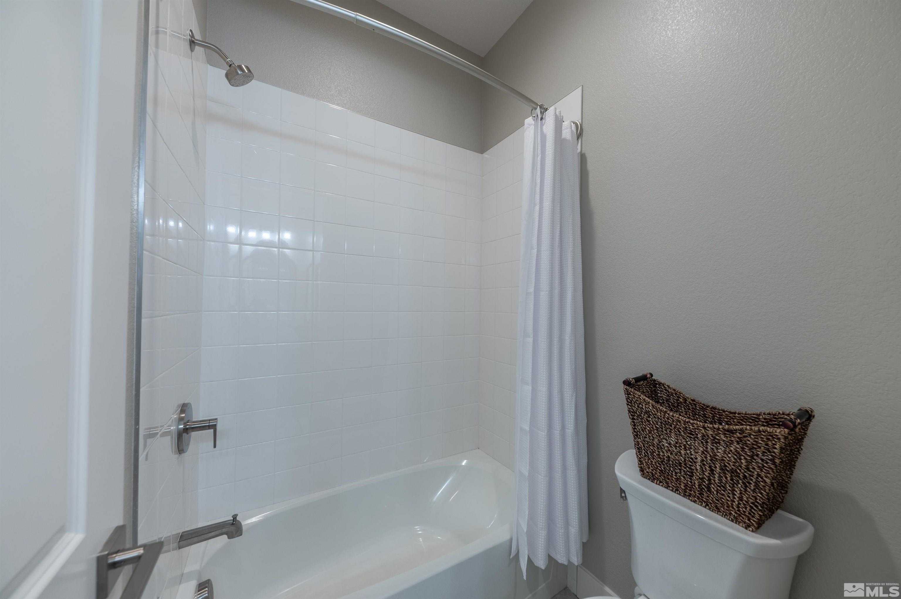 2962 Saddle Peak Drive Reno, NV 89521 - Photo 32 of 39 a bathroom with a toilet and shower