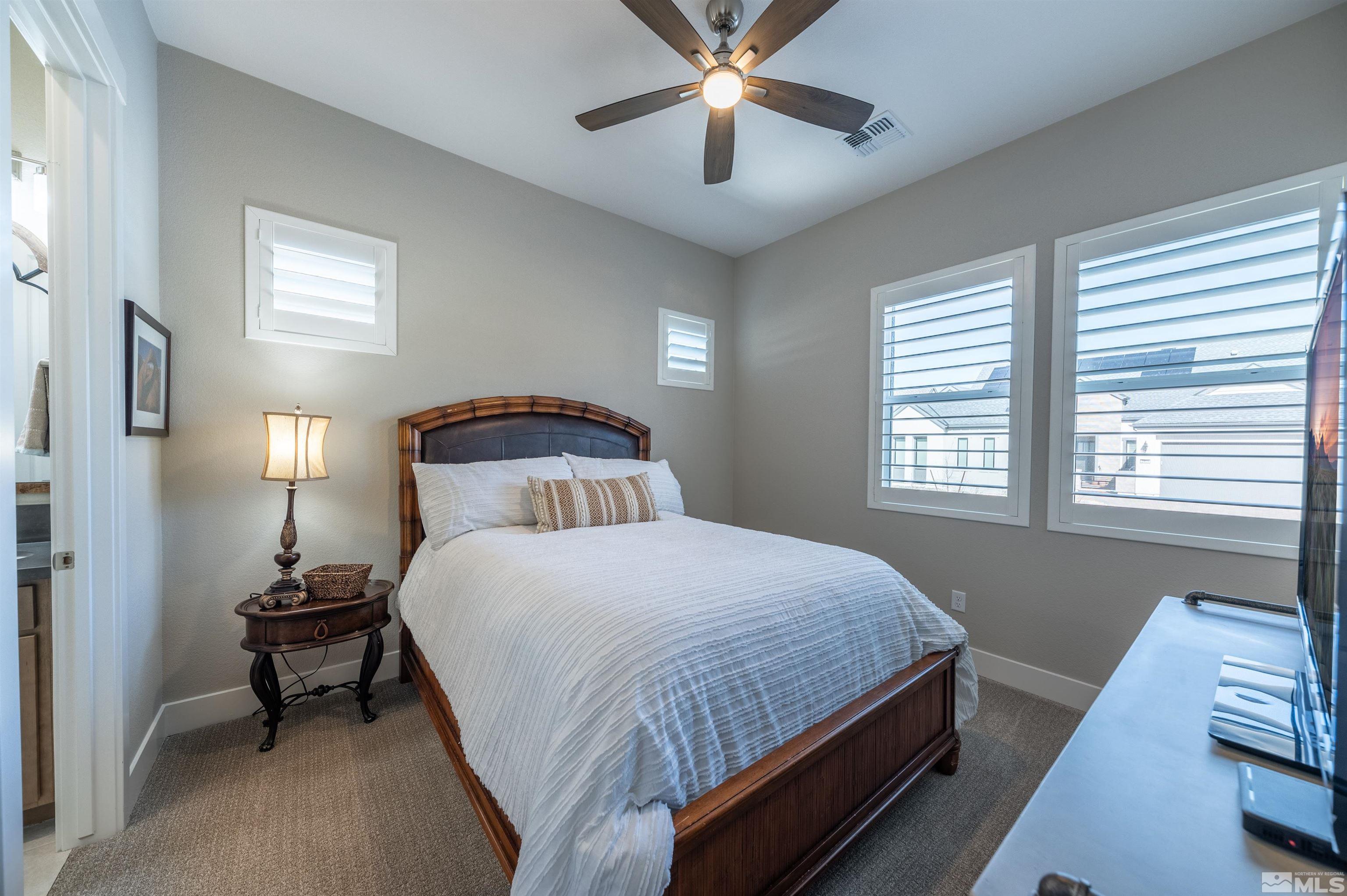 2962 Saddle Peak Drive Reno, NV 89521 - Photo 33 of 39 a bedroom with a bed and a window