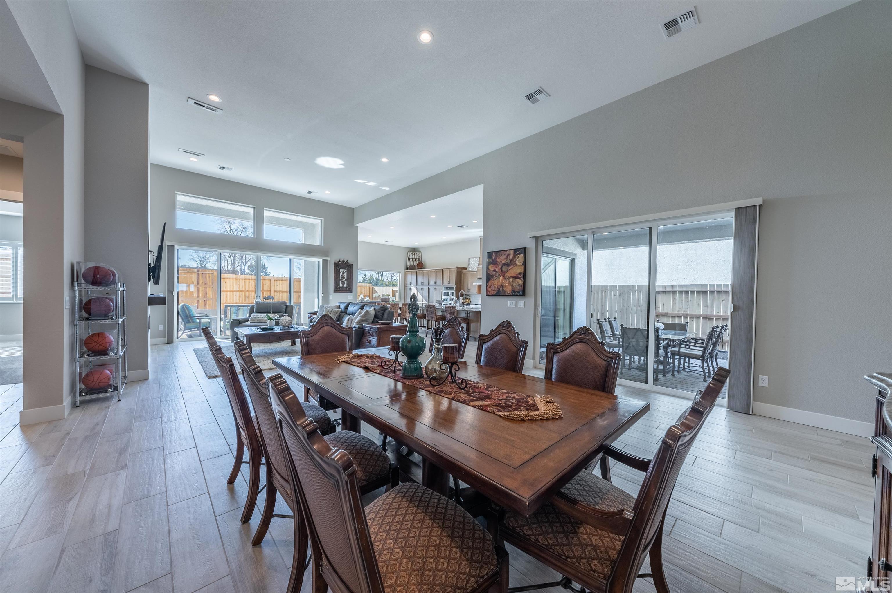 2962 Saddle Peak Drive Reno, NV 89521 - Photo 9 of 39 a dining room with furniture and wooden floor
