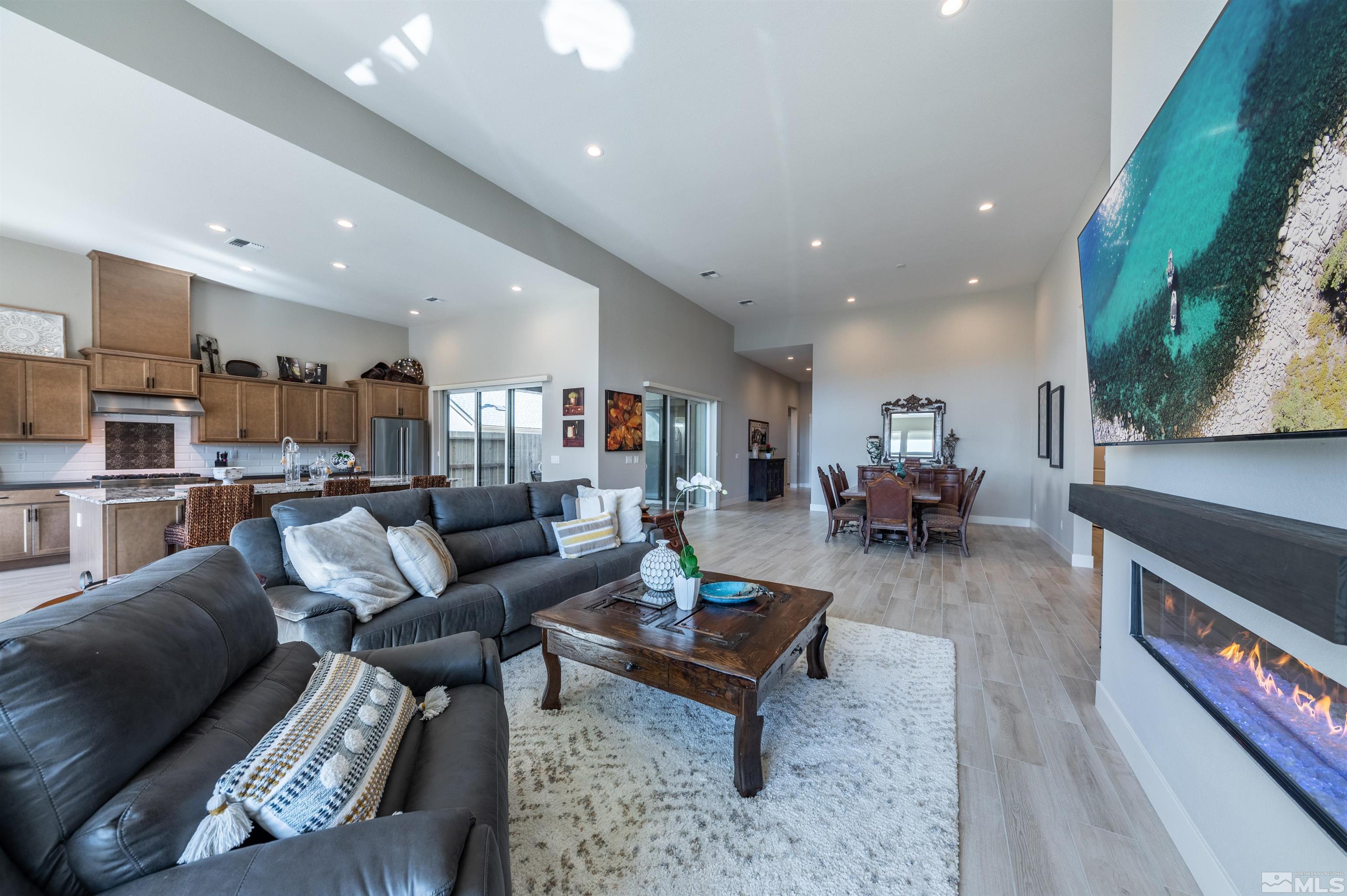 2962 Saddle Peak Drive Reno, NV 89521 - Photo 10 of 39 a living room with furniture and a dining table with kitchen view