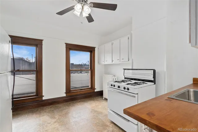 a kitchen with stainless steel appliances granite countertop a stove and a refrigerator