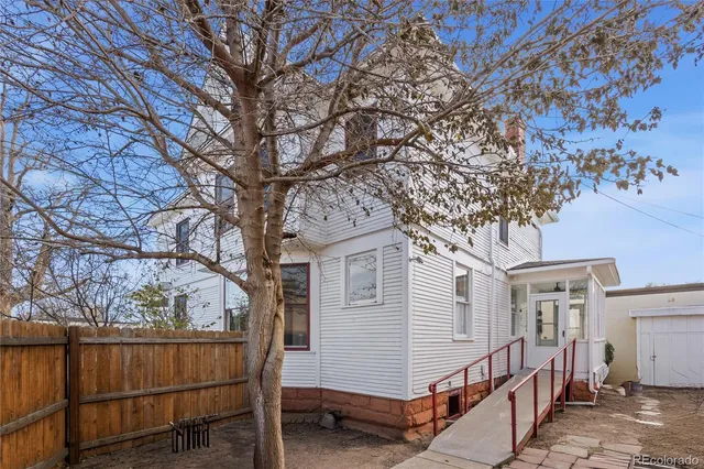 a view of a house with a bench