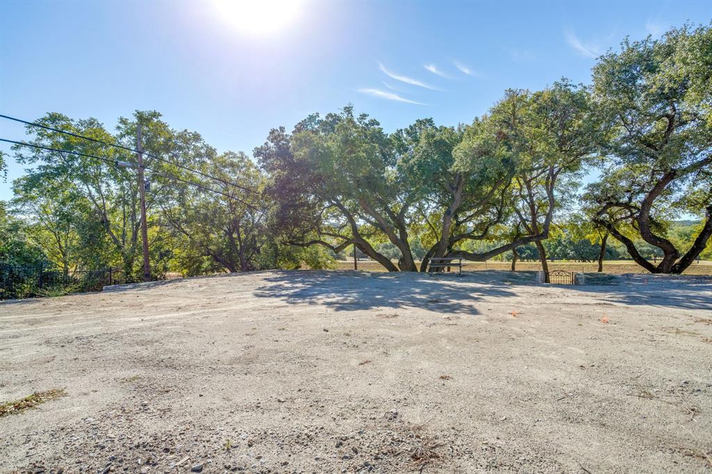 628 Athenia Drive Fort Worth, TX 76114 - Photo 2 of 24 a view of a yard with a tree
