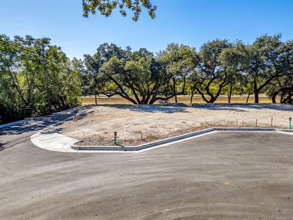 628 Athenia Drive Fort Worth, TX 76114 - Photo 21 of 24 a view of a wooden house with a yard