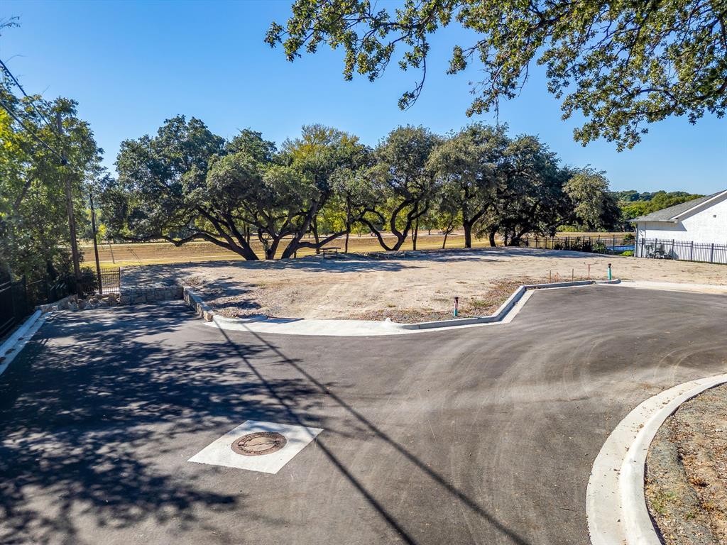 628 Athenia Drive Fort Worth, TX 76114 - Photo 22 of 24 a view of a yard with trees