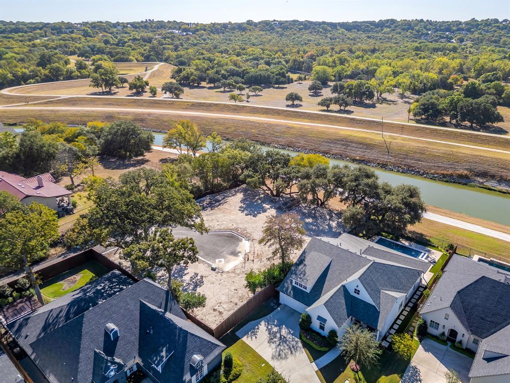 628 Athenia Drive Fort Worth, TX 76114 - Photo 6 of 24 an aerial view of a house with a yard pool outdoor seating and city view