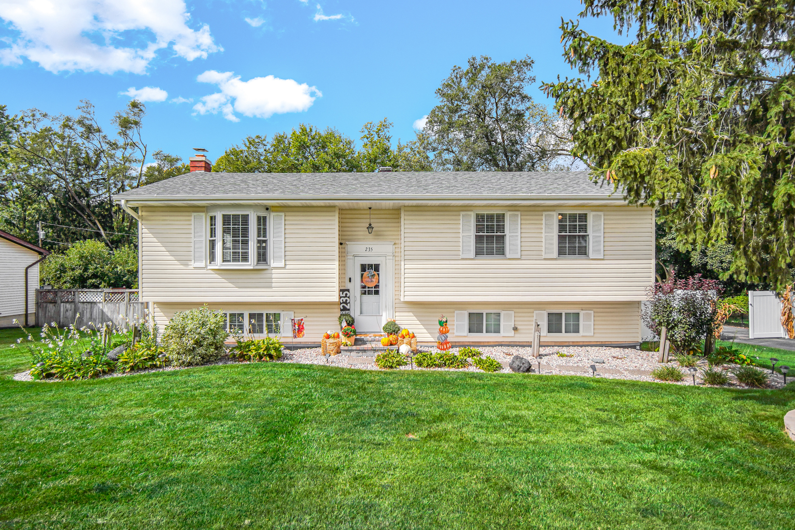 235 Roberts Road New Lenox, IL 60451 - Photo 1 of 25 a view of an house with backyard space and garden