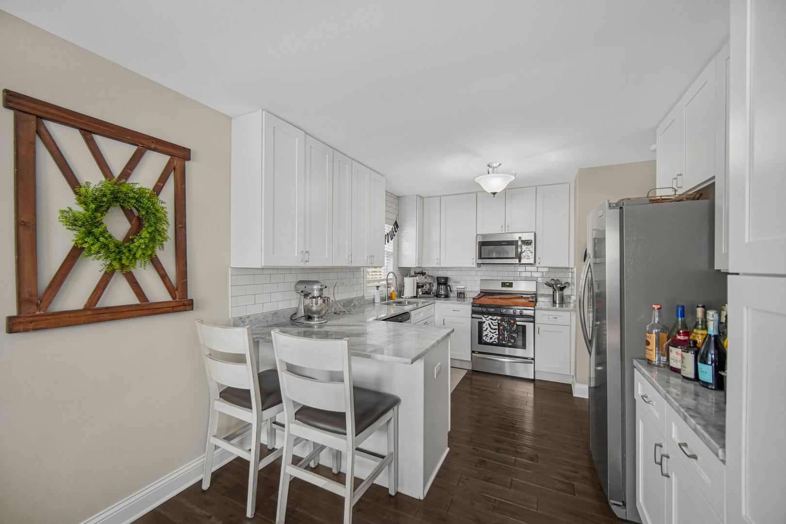 235 Roberts Road New Lenox, IL 60451 - Photo 7 of 25 a kitchen with stainless steel appliances a refrigerator and a stove