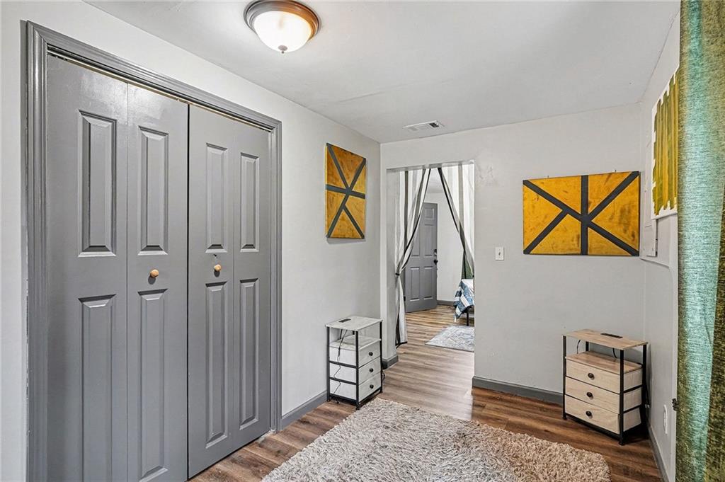 123 Brawner Street Griffin, GA 30223 - Photo 23 of 25 a view of entryway with stairs and a chandelier