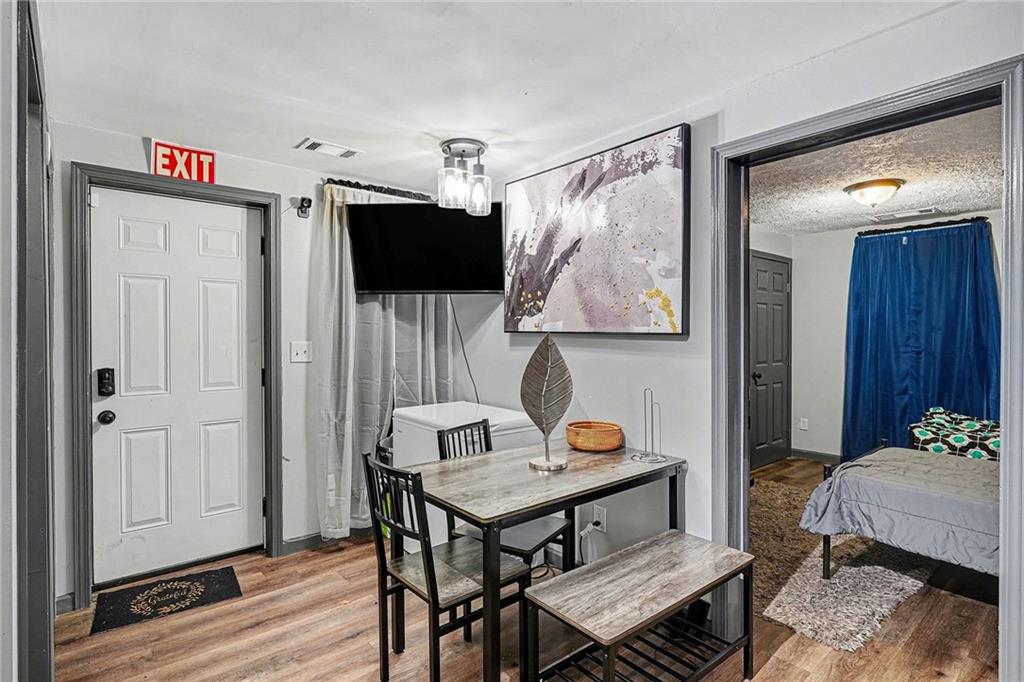 123 Brawner Street Griffin, GA 30223 - Photo 4 of 25 a living room with furniture and a flat screen tv