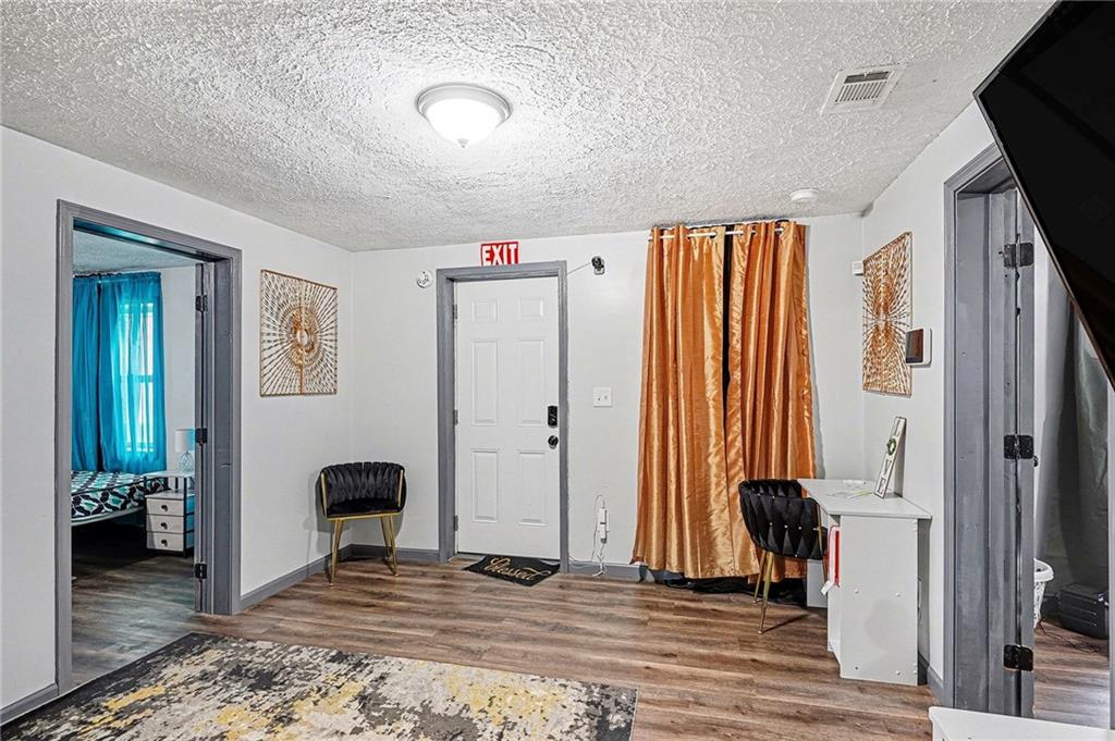 123 Brawner Street Griffin, GA 30223 - Photo 9 of 25 a view of a bedroom with wooden floor and bedroom