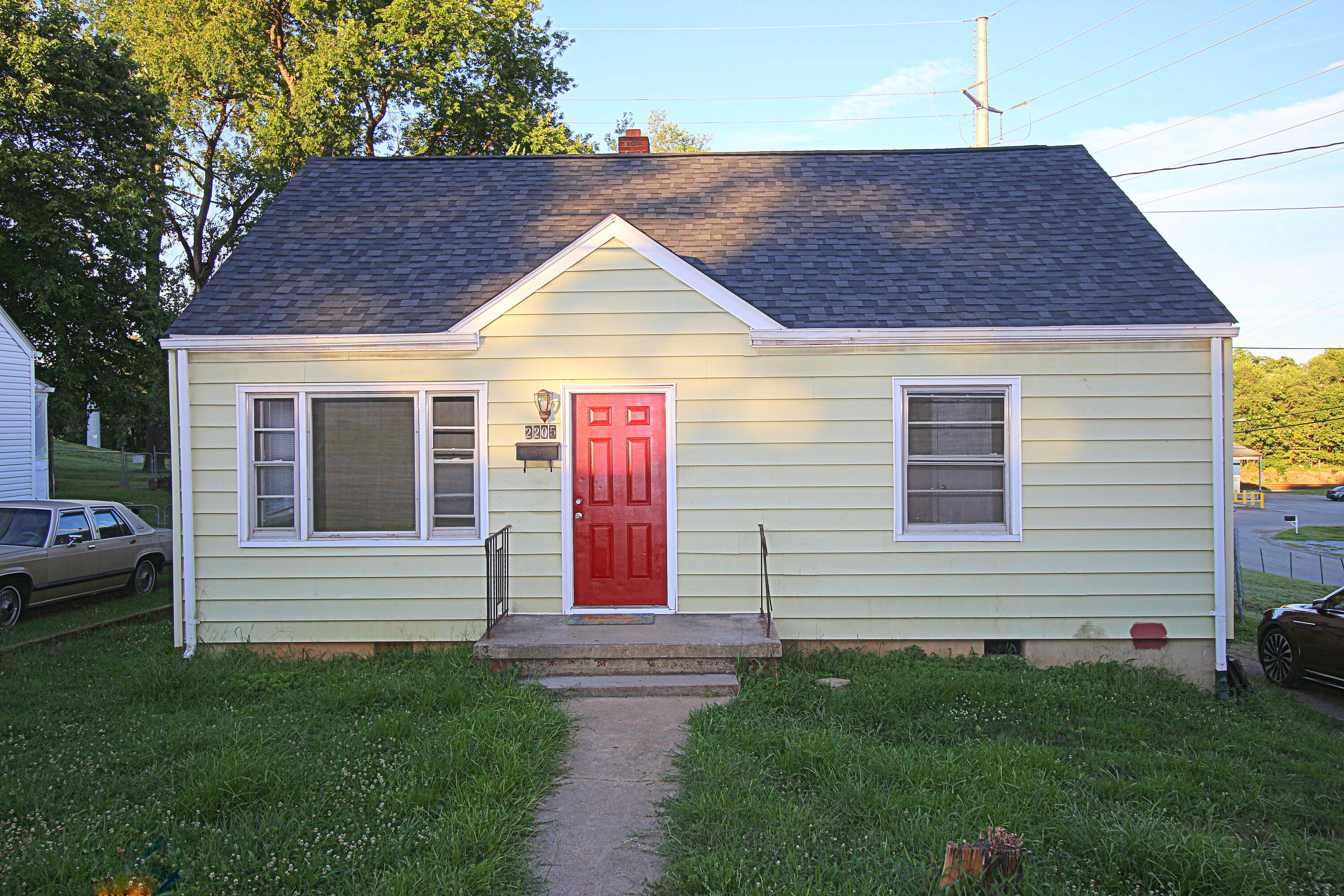 2205 Plantation Road Northeast Roanoke, VA 24012 - Photo 2 of 13 a front view of a house with a yard