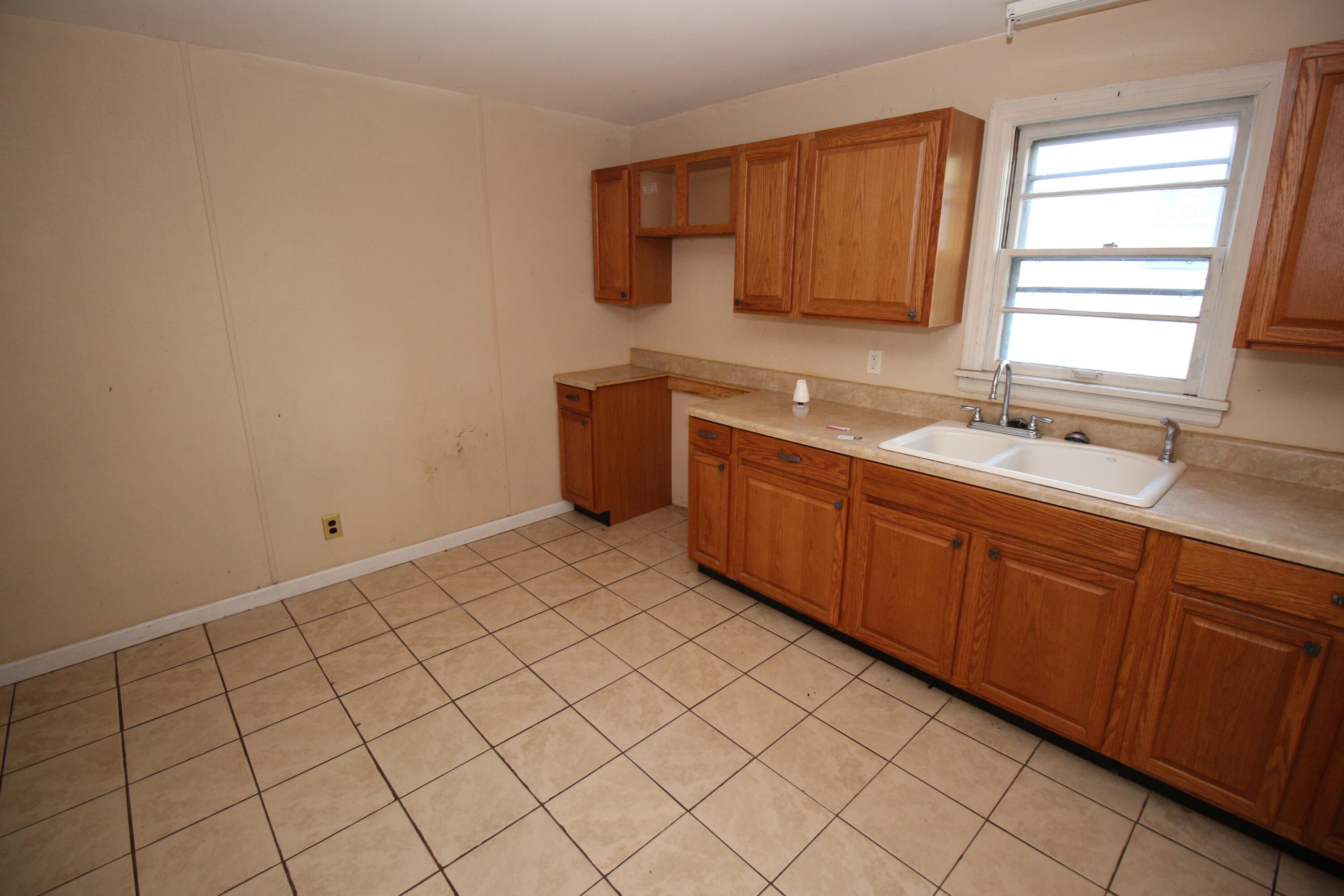 2205 Plantation Road Northeast Roanoke, VA 24012 - Photo 12 of 13 a kitchen with a sink and cabinets
