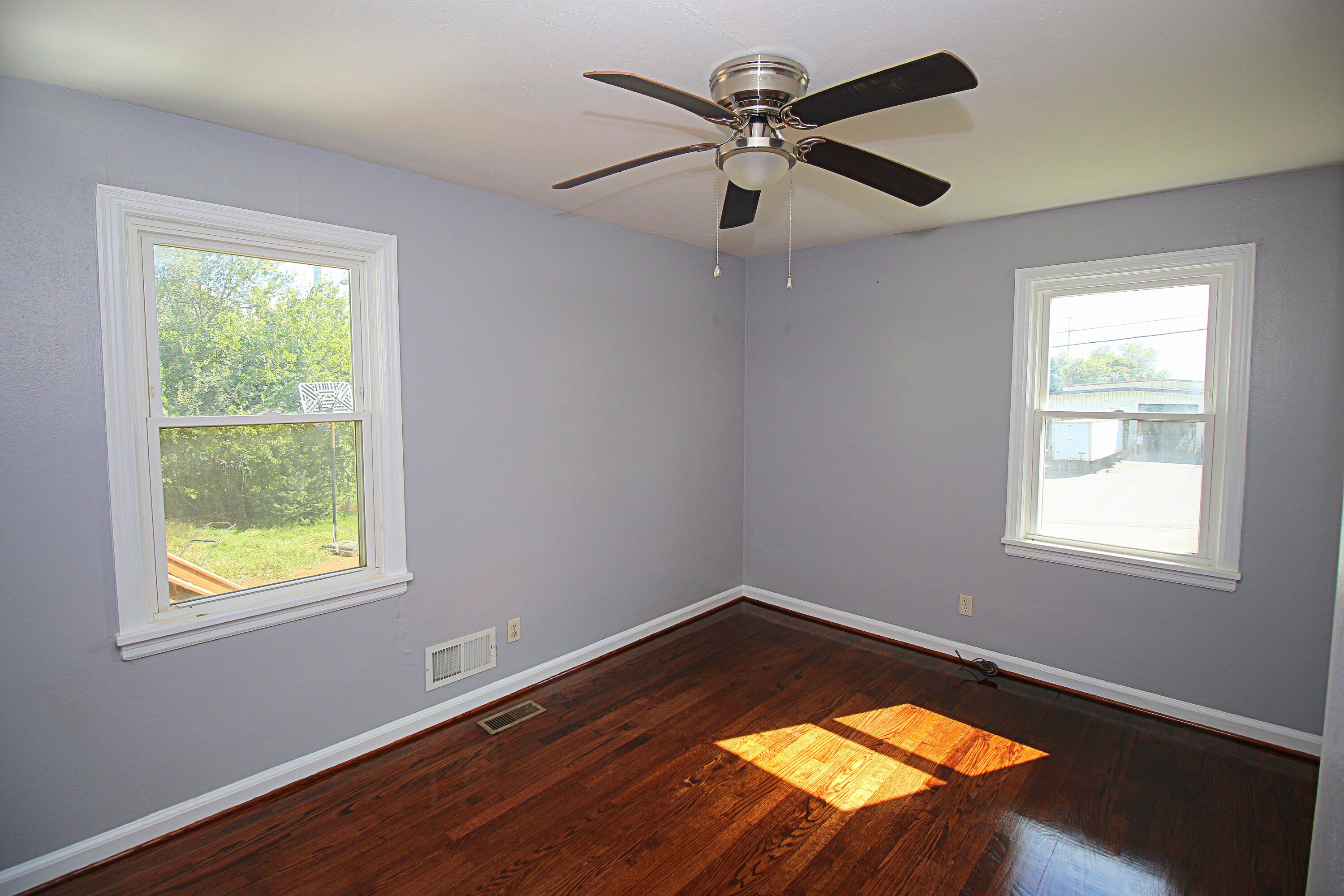 2205 Plantation Road Northeast Roanoke, VA 24012 - Photo 7 of 13 a view of a big room with wooden floor and windows