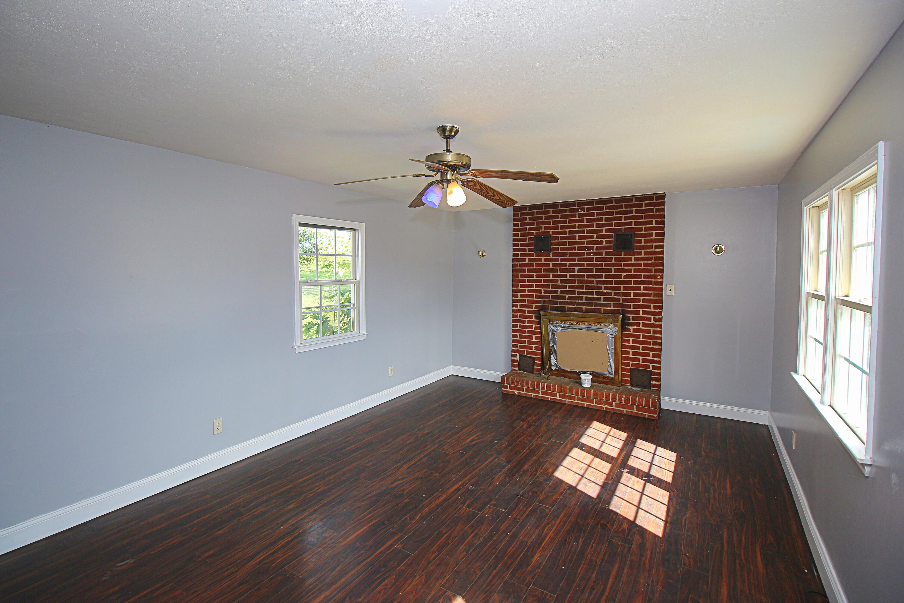 2205 Plantation Road Northeast Roanoke, VA 24012 - Photo 8 of 13 wooden floor in an empty room with a window