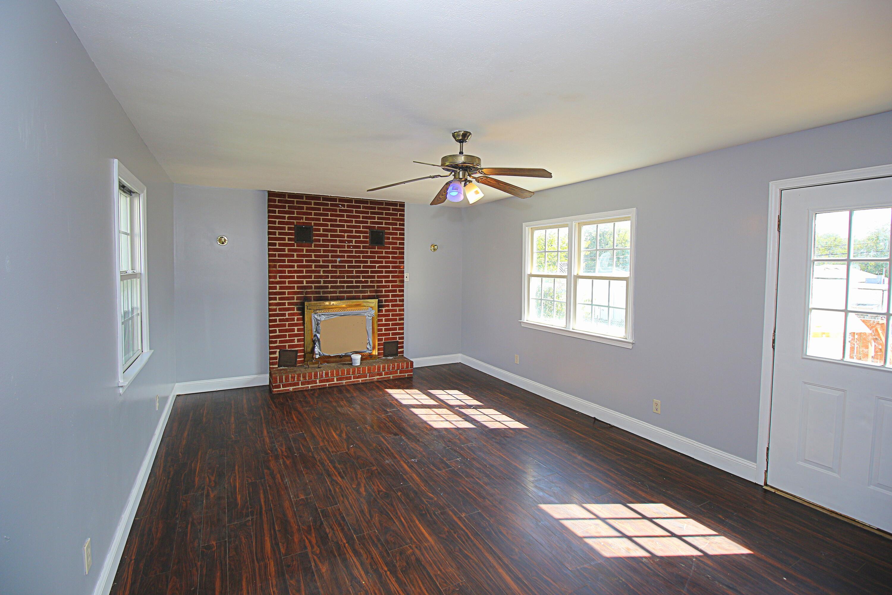 2205 Plantation Road Northeast Roanoke, VA 24012 - Photo 9 of 13 a view of an empty room with wooden floor and a window
