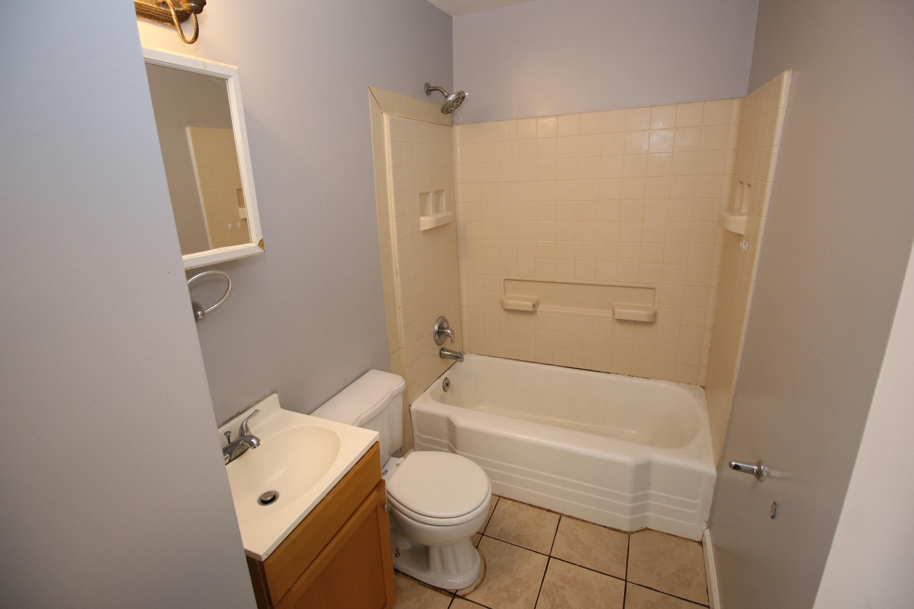 2205 Plantation Road Northeast Roanoke, VA 24012 - Photo 10 of 13 a bathroom with a toilet and a shower