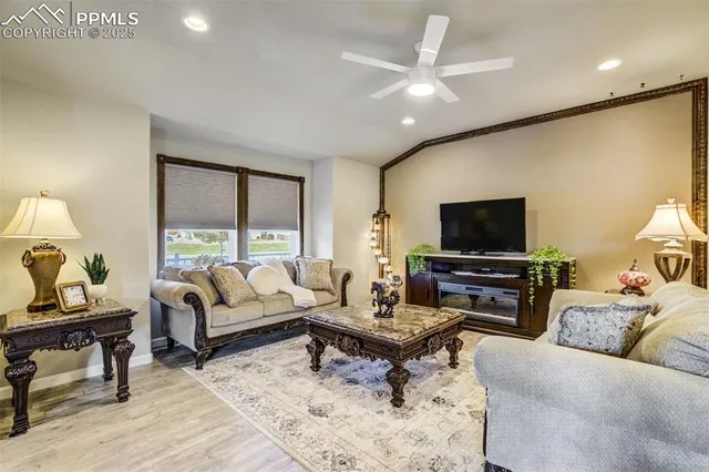 a living room with furniture and a flat screen tv