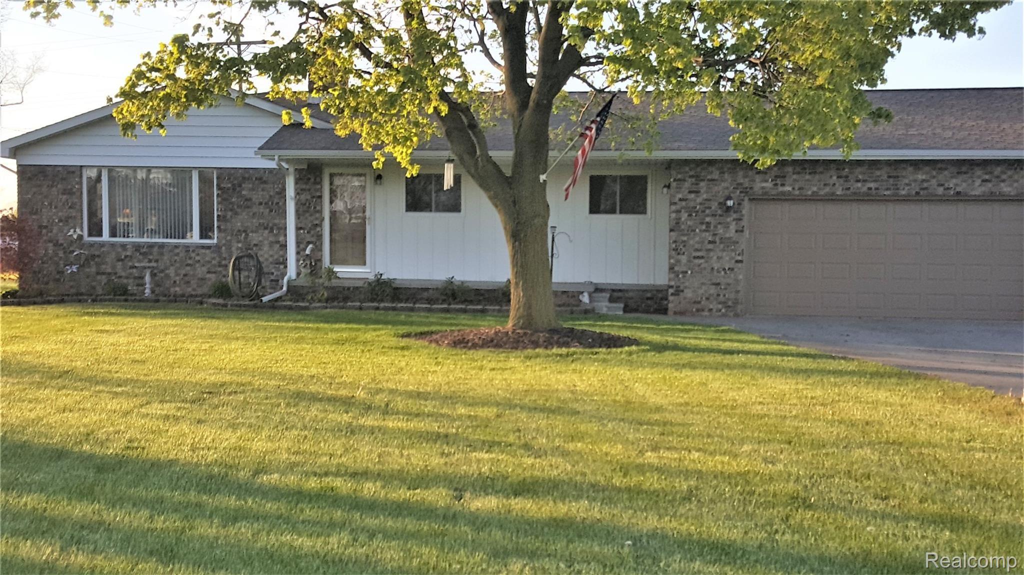 Gorgeous shade tee in front yard.